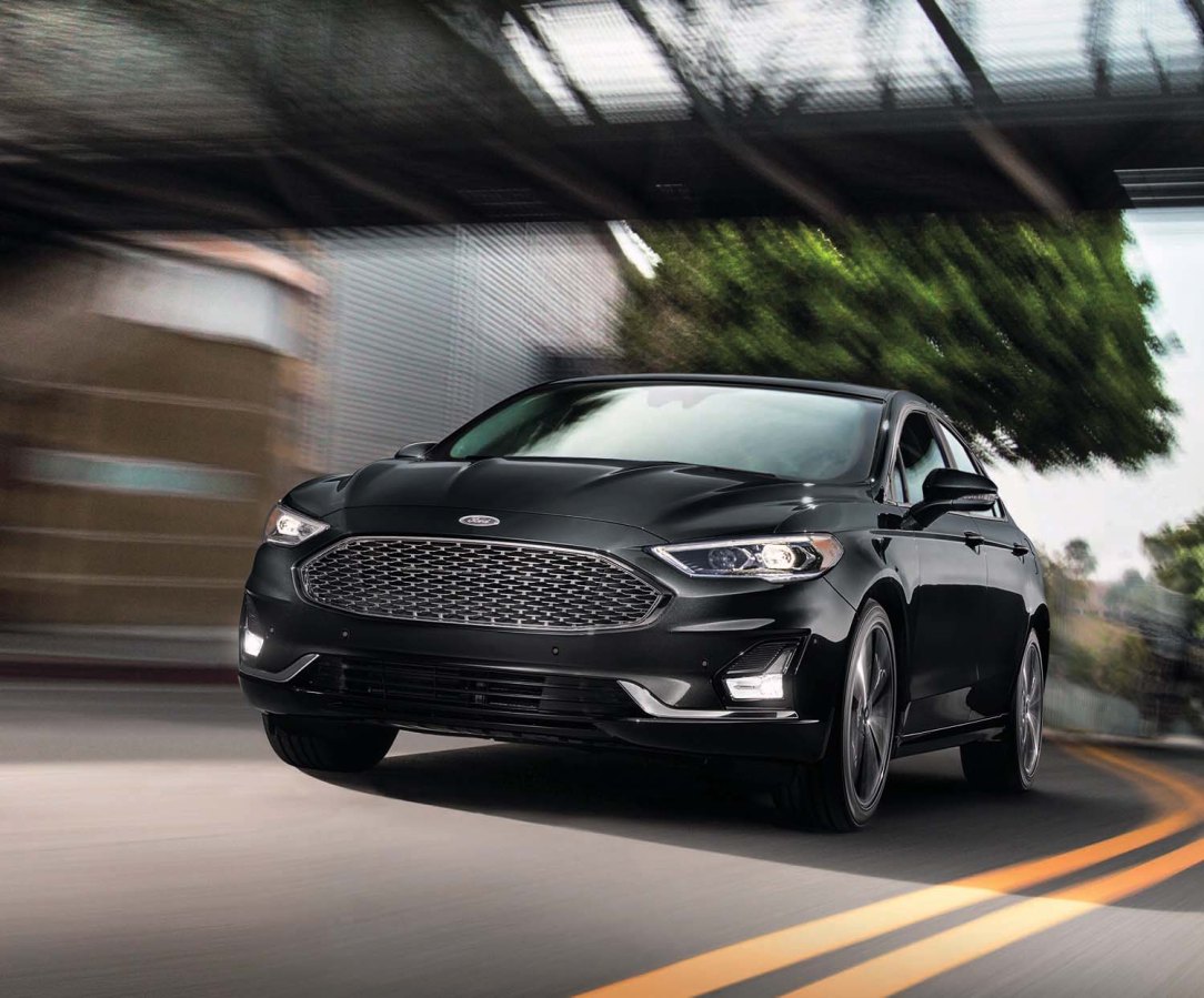 FL9497519_FUSI_BEV_Titan_34FrntDrvrMotnRichCopper_mj